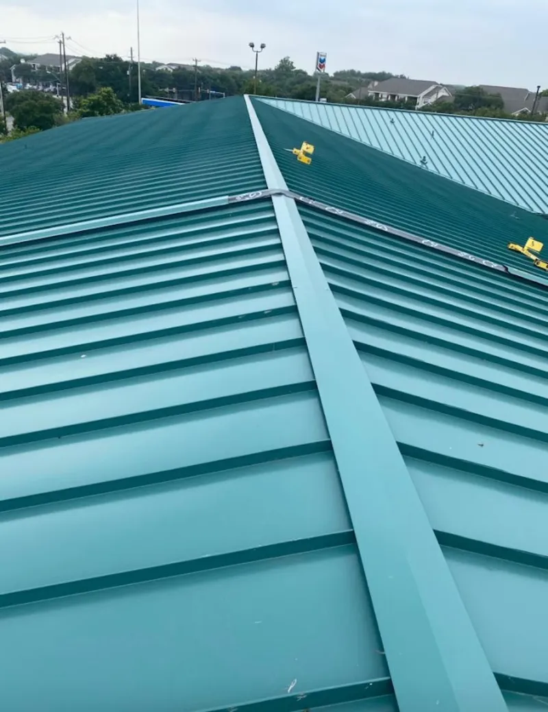 Green commercial metal roof ridge and valley for Metal Roof Repair in Laplace