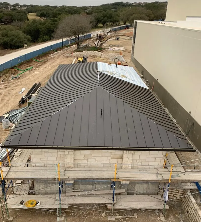 Metal roof new construction with scaffolding in Laplace